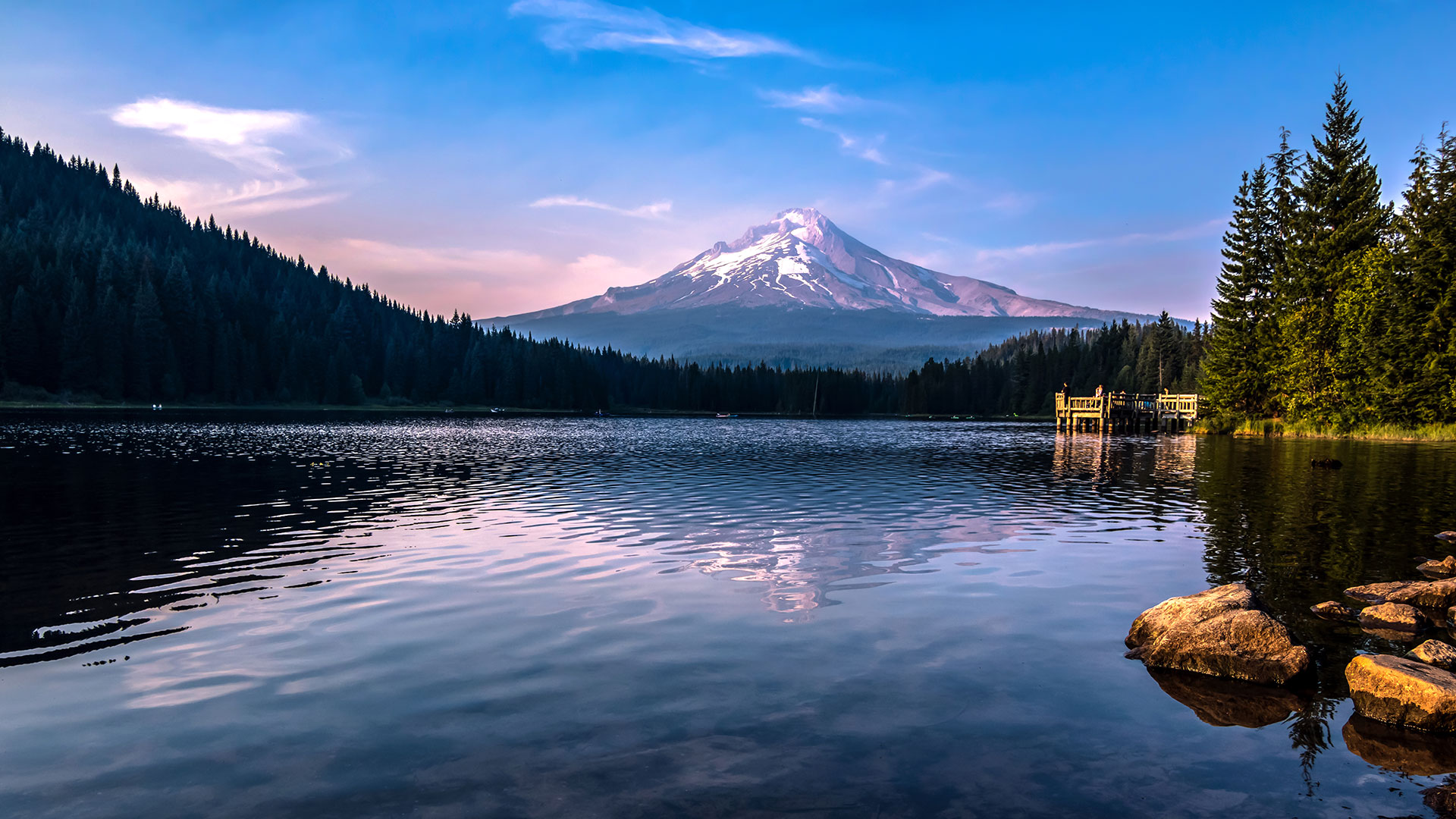 A panoramic view of snow-covered Mt. Hood in Oregon at dusk.